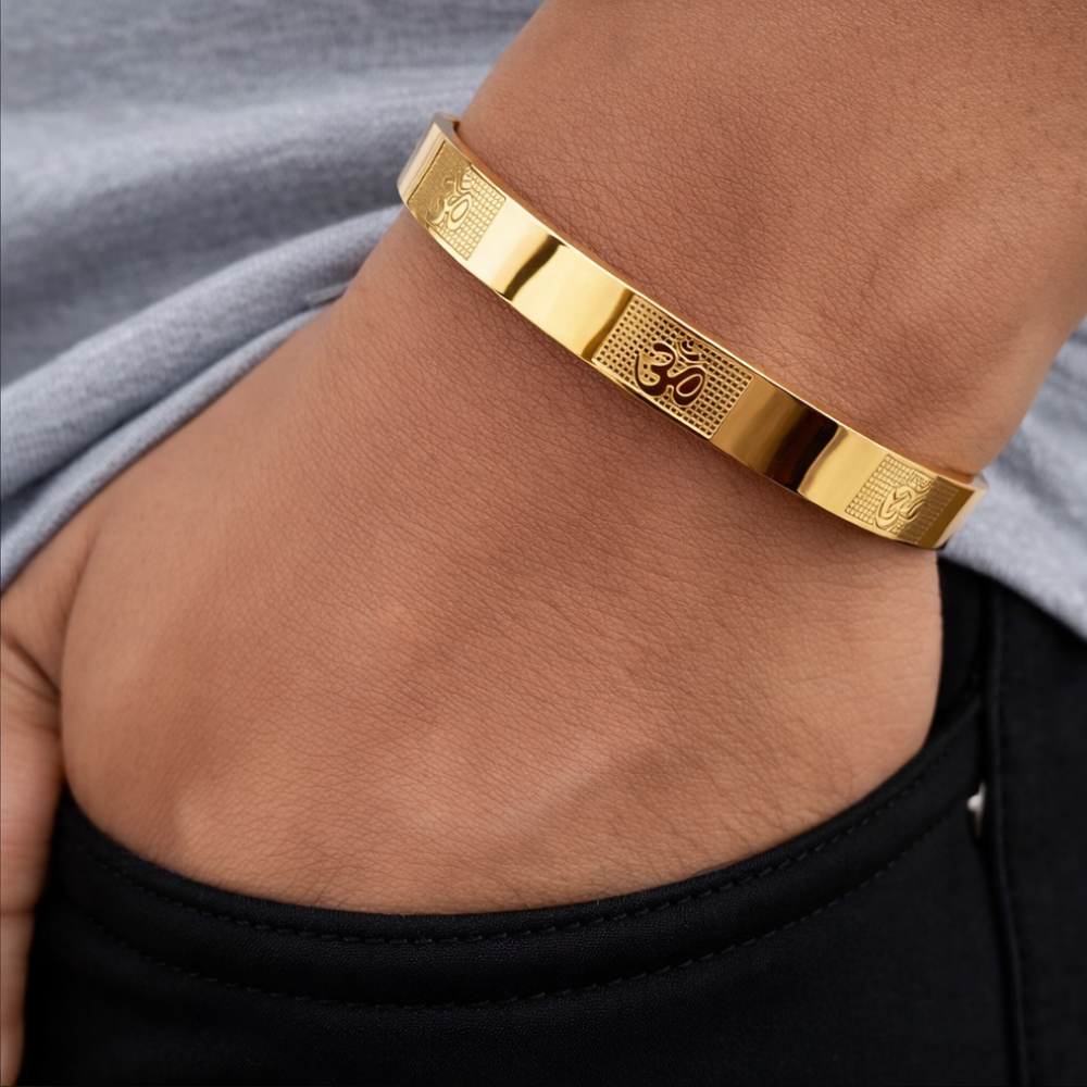 Model wearing  Mens Om Carved Gold Bracelet