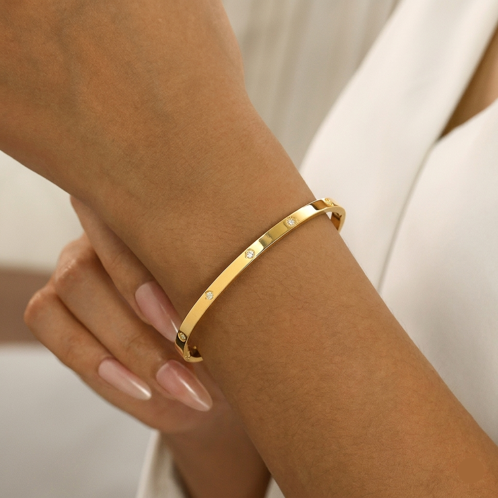Women Wearing Thin Studded Gold Bangle Bracelet