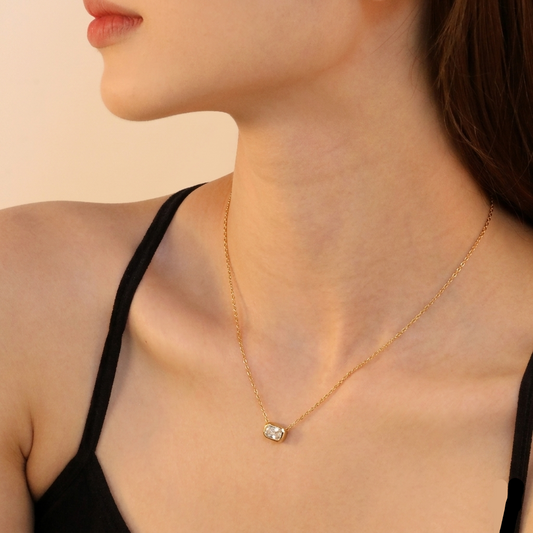Women Wearing Emerald Cut Crystal Pendant Necklace